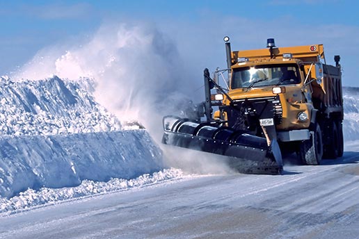 Snowplow clearing road