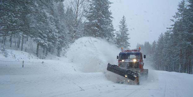 Snowplow clearing road