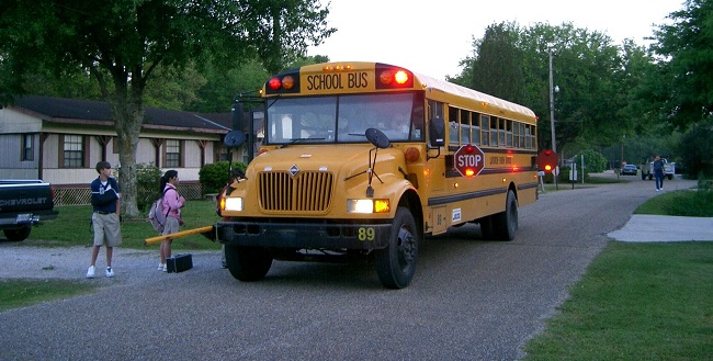Children boarding a school bus