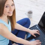 Teen girl taking drivers ed course online