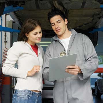 Woman talking with a mechanic