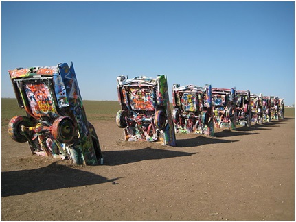 Row of Cadillacs buried in the ground